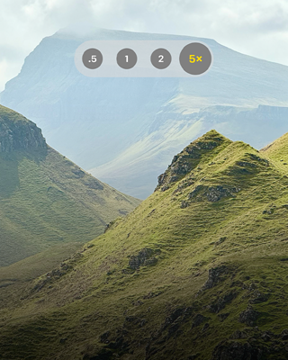 A picturesque mountain scene showcasing the longest optical zoom ever in an iPhone, now up to 5x