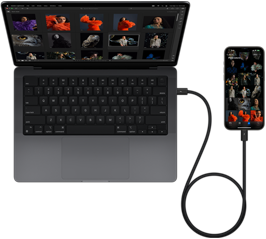 Ein iPhone 15 Pro Max ist über USB-C mit dem 14" MacBook Pro verbunden